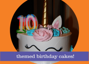 A unicorn cake with the number 10 and words that read themed birthday cakes