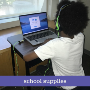 child wearing headphones at a computer