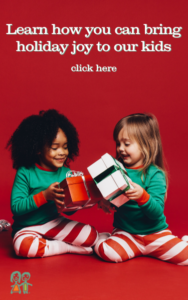 Two little girls wearing holiday pajamas holding gifts with the words that read learn how you can bring holiday joy to our kids click here