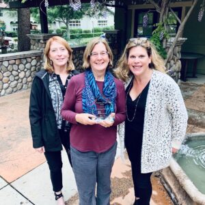 Five Acres Guild Volunteer Florence Nelson receives volunteer award with Ruth Coyne and Chief Advancement Officer Jennifer Berger