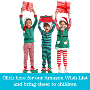Three children dressed in holiday pajamas carrying gift boxes with words below that read click here for our Amazon Wish List and bring cheer to children