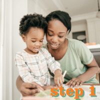 Parent helping child with drawing