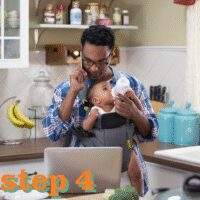 Man caring for baby and working