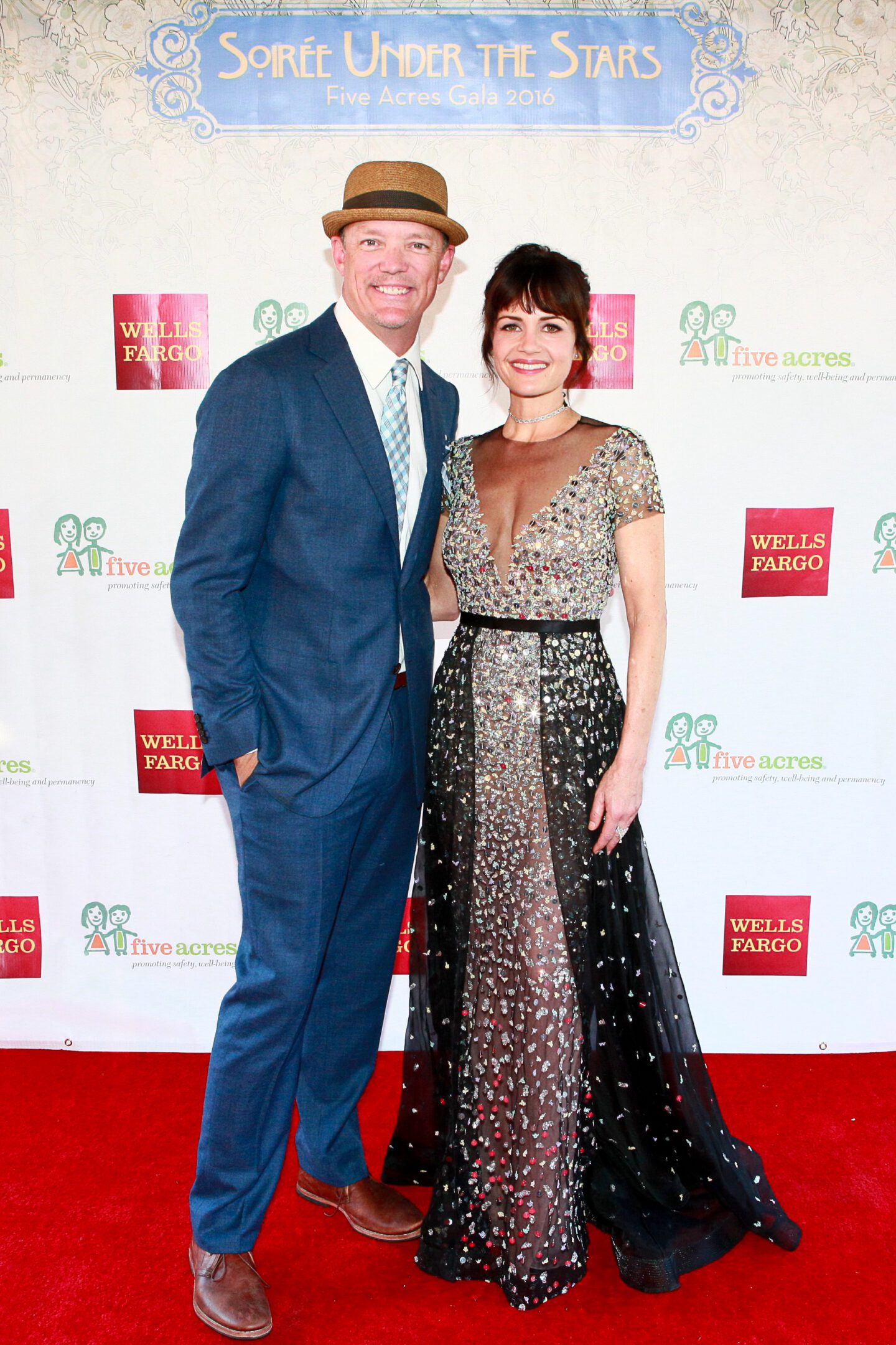 Smiling duo at formal gathering