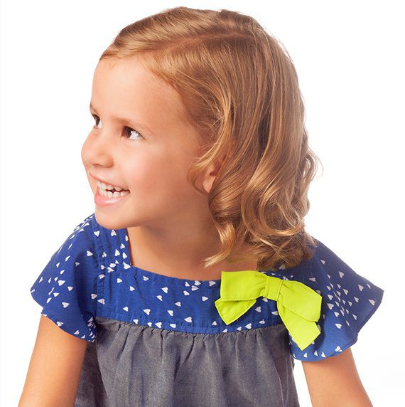 Girl in blue dress with bow