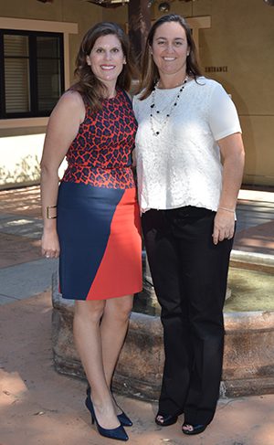 Smiling women posing outdoors