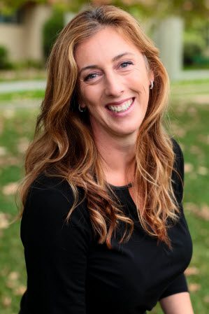 Happy woman sitting on grass